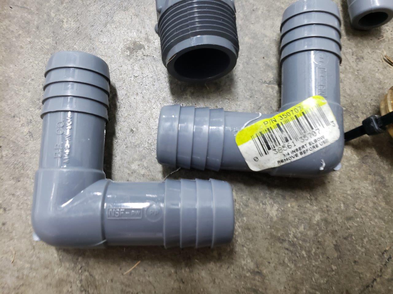 A bunch of miscellanous outdoor piping fittings and caps