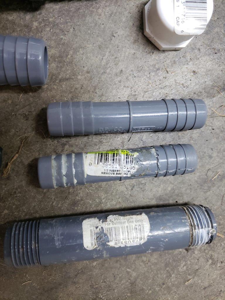 A bunch of miscellanous outdoor piping fittings and caps