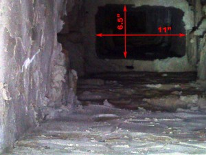 There is a narrow passage 6 feet below the top or the chimney (just below root level) that measures 6.75 by 11 inches